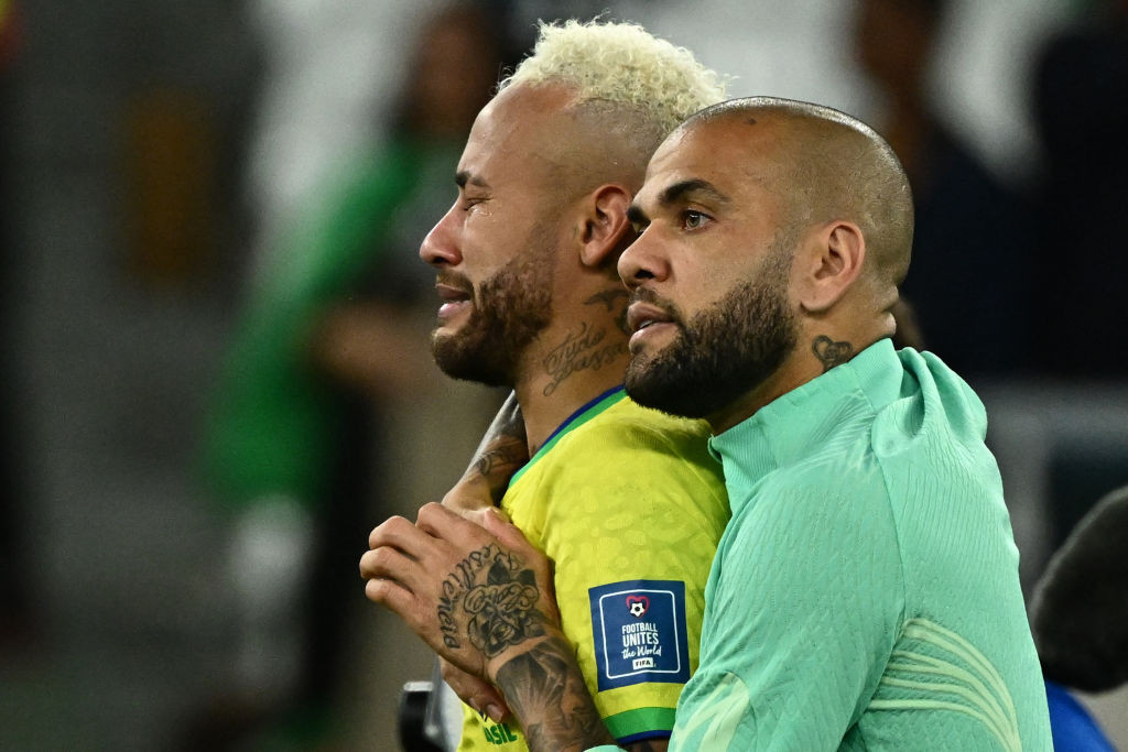 Brazil's Neymar and Alves after losing on penalties at the 2022 World Cup in Qatar. GETTY IMAGES