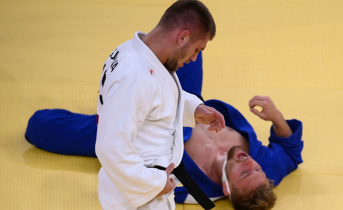Akil Gjakova (in white) after taking down an opponent at Tokyo 2020. GETTY IMAGES
