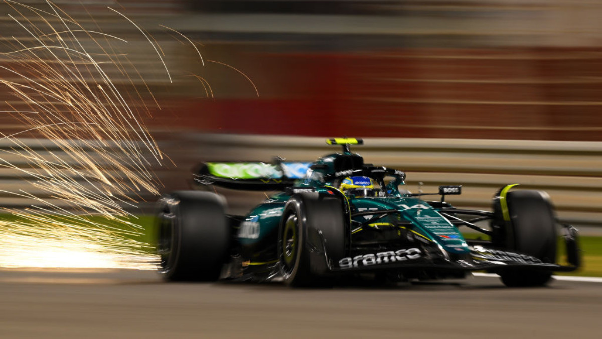 Sparks fly behind Fernando Alonso in the Aston Martin. GETTY IMAGES