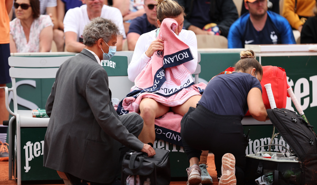 Romania's Halep receives medical treatment at Roland Garros in 2022. GETTY IMAGES