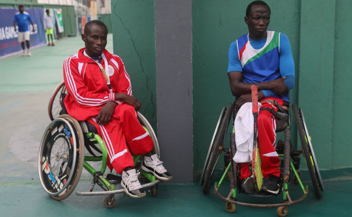 Salifu Kujabi (R) with a team member at the first African Para Games in Accra. GETTY IMAGES