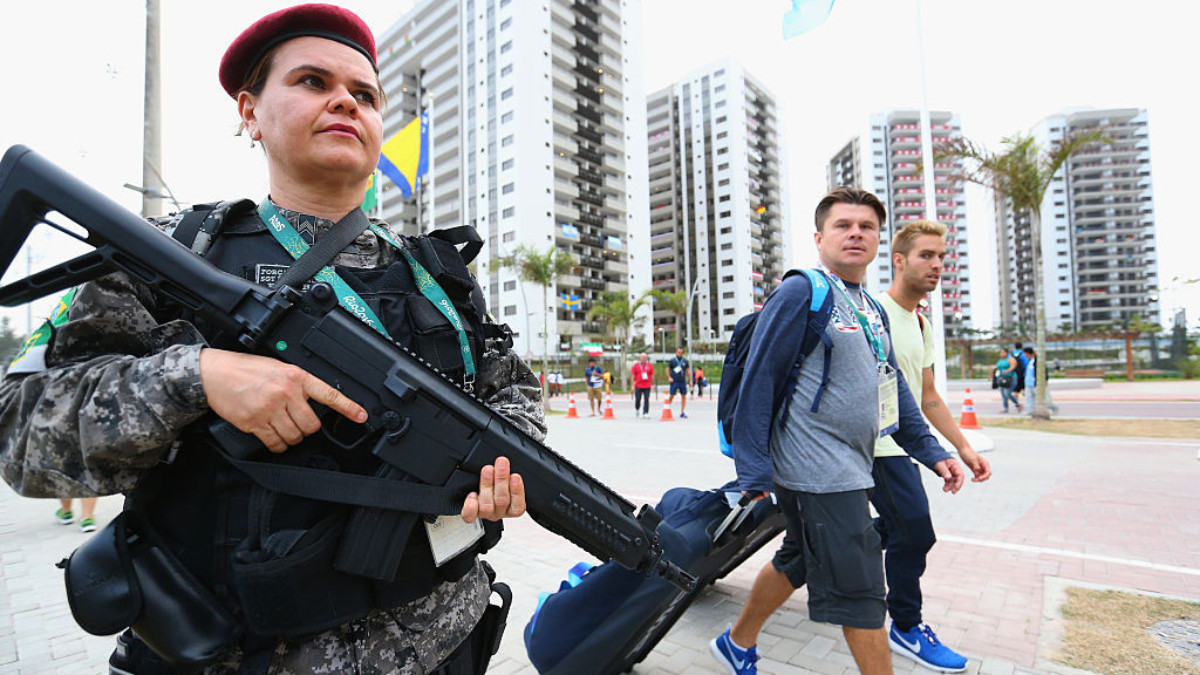 A police security officer walks through the Olympic Village at Rio 2016. GETTY IMAGES