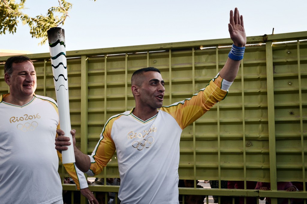 Syrian refugee carries Olympic flame during Rio 2016 Torch Relay in Greece
