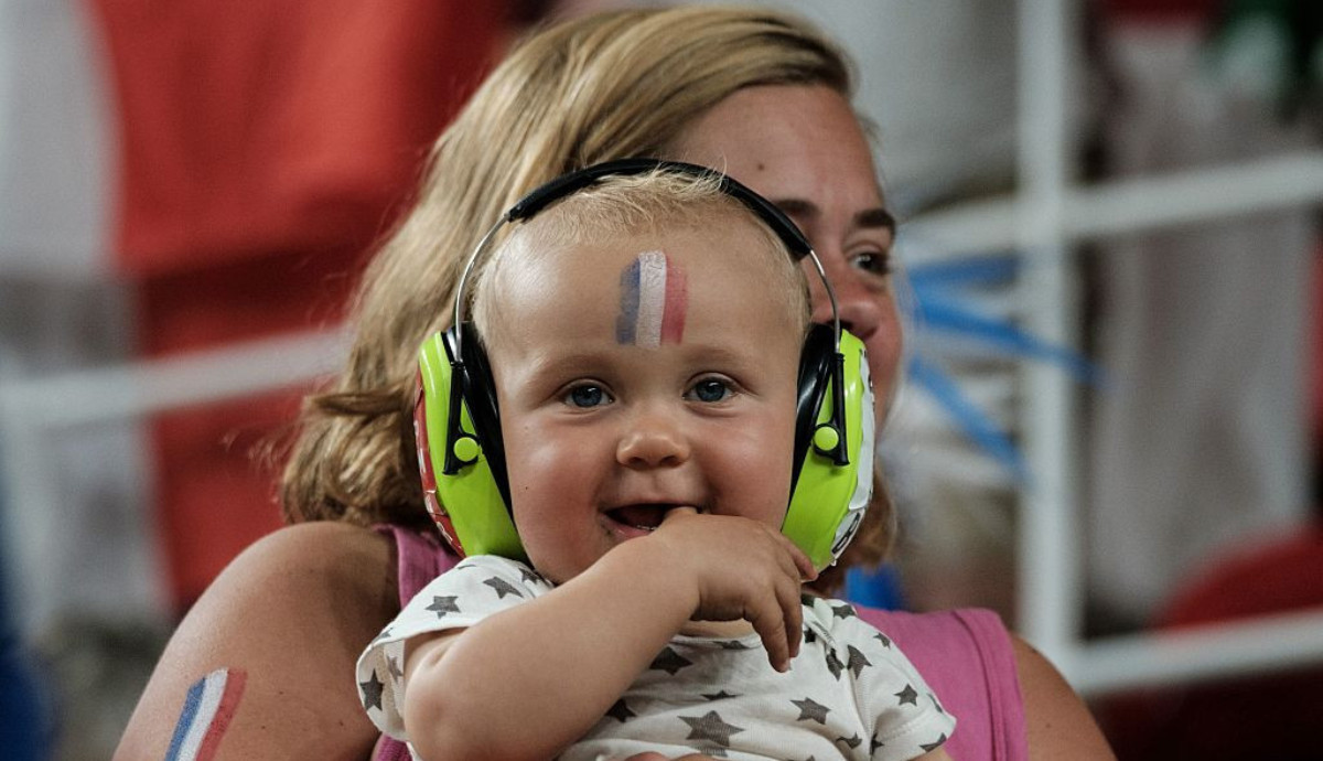 A baby wears headphones at the 2016 Paralympic Games in Rio de Janeiro. GETTY IMAGES