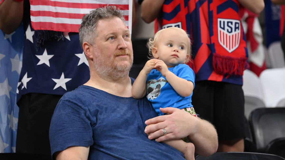 A USA fan holds a baby at the Al Bayt Stadium at the FIFA World Cup Qatar 2022. GETTY IMAGES 