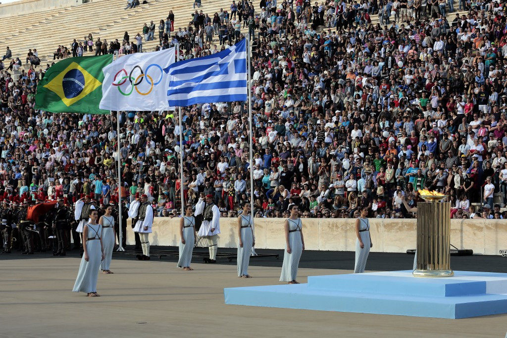 The Brazilian, Olympic and Greek flags fly over the Panathinaiko Stadium in Athens during the Handover Ceremony of the flame to Rio 2016 ©Getty Images