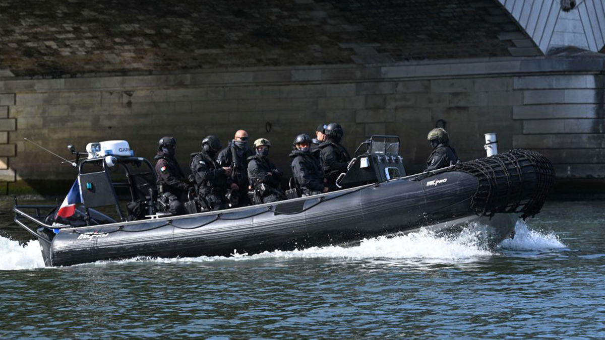 French police in a Zodiac boat on the River Seine. GETTY IMAGES