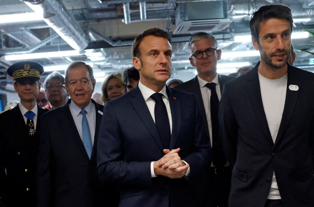 Emmanuel Macron (C), Tony Estanguet (R) and Patrick Ollier (2nd L), president of the Grand Paris Metropole. GETTY IMAGES