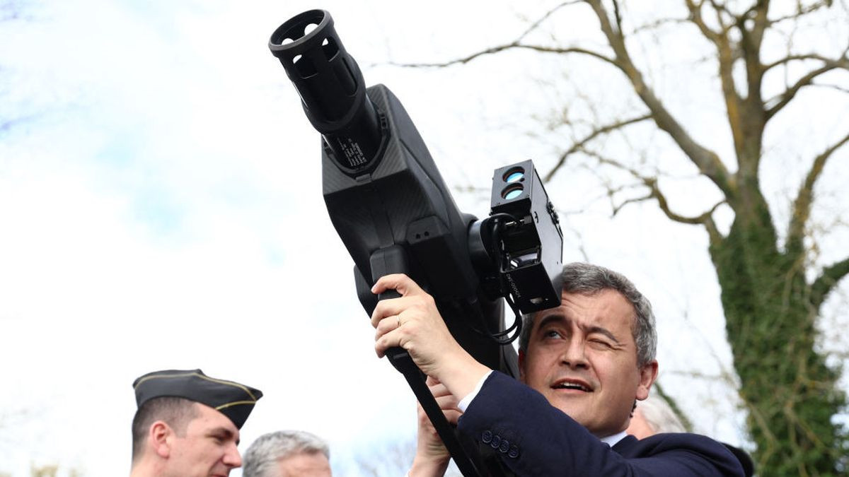French Minister Gerald Darmanin holds an anti-drone weapon. GETTY IMAGES