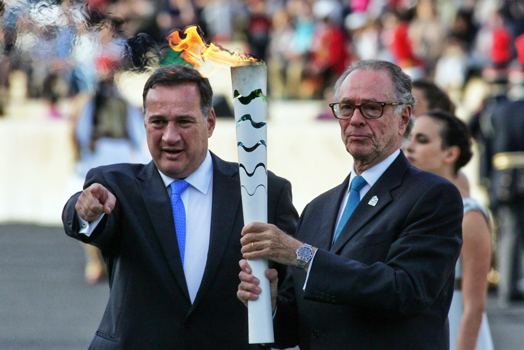 Rio 2016 President Carlos Nuzman (right) received the Olympic Torch from Spyros Capralos, head of the Hellenic Olympic Committee (left) in Athens ©Getty Images