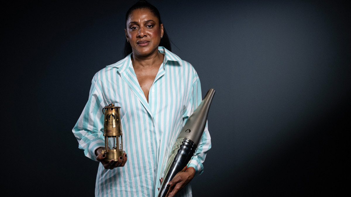 Legendary three-time Olympic gold medallist Marie-Jose Perec, with the Olympic Torch. GETTY IMAGES