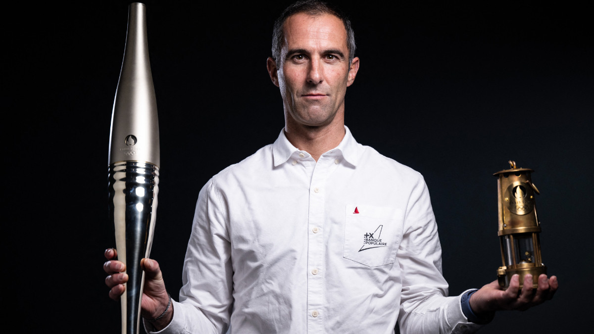 French skipper Armel Le Cleac'h poses with the Olympic Torch. GETTY IMAGES
