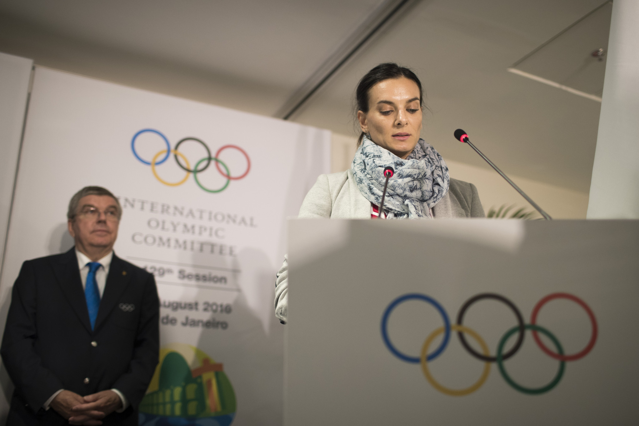 Bach on the back of Russian IOC member Yelena Isinbayeva. GETTY IMAGES