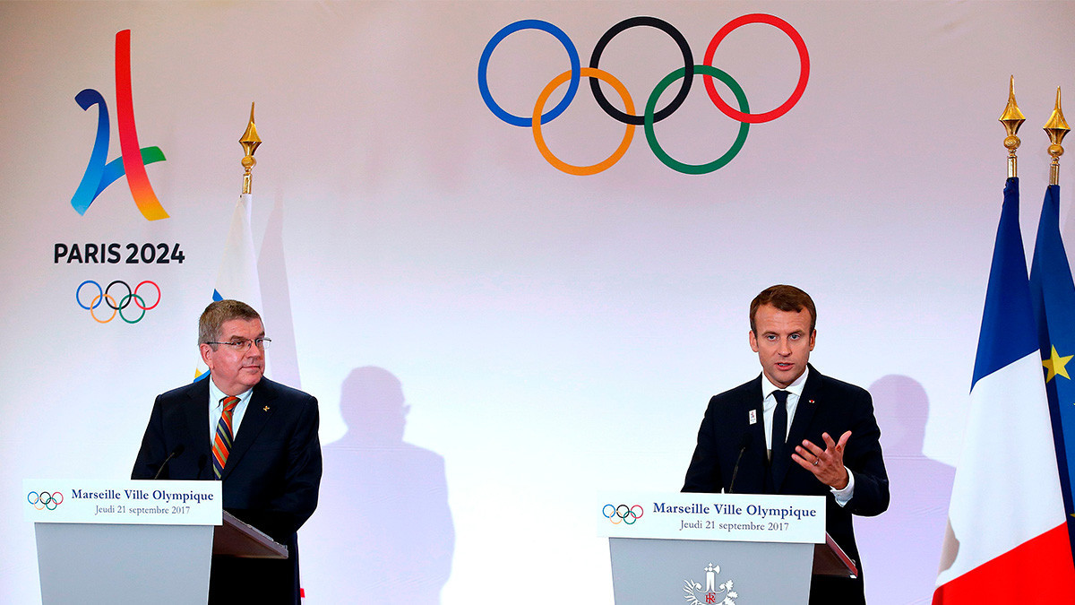 IOC President Germany's Thomas Bach and French President Emmanuel Macron. GETTY IMAGES