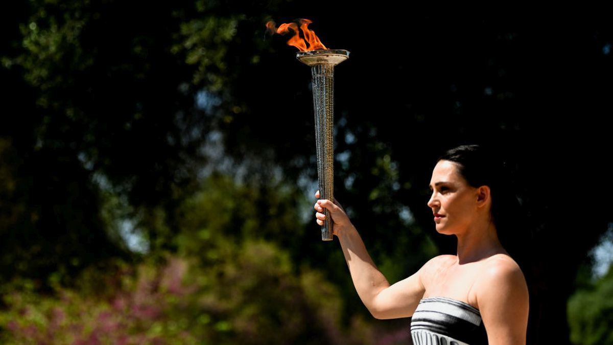 Greek actress Mary Mina holds the torch during the Paris 2024 flame lighting ceremony. GETTY IMAGES