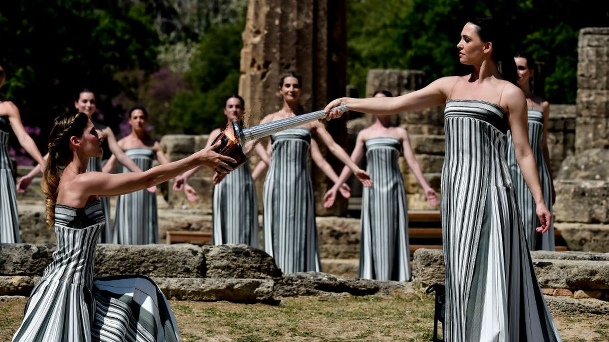 Mary Mina lights a cauldron at the archaeological site of Ancient Olympia. GETTY IMAGES