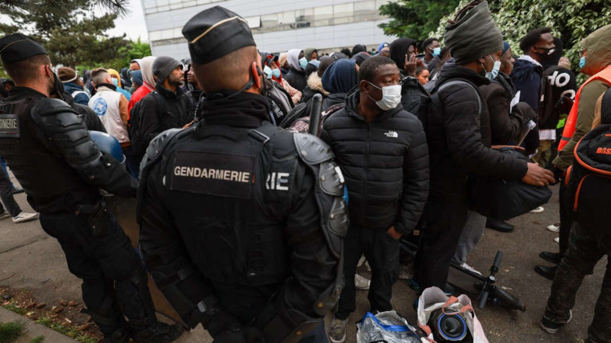 Migrants are evicted from an abandoned building in Paris on Wednesday, April 17. GETTY IMAGES