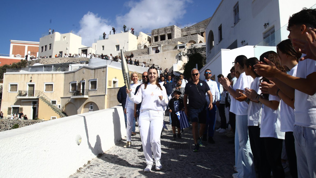 The Olympic flame travels from Santorini to the Acropolis. HOC