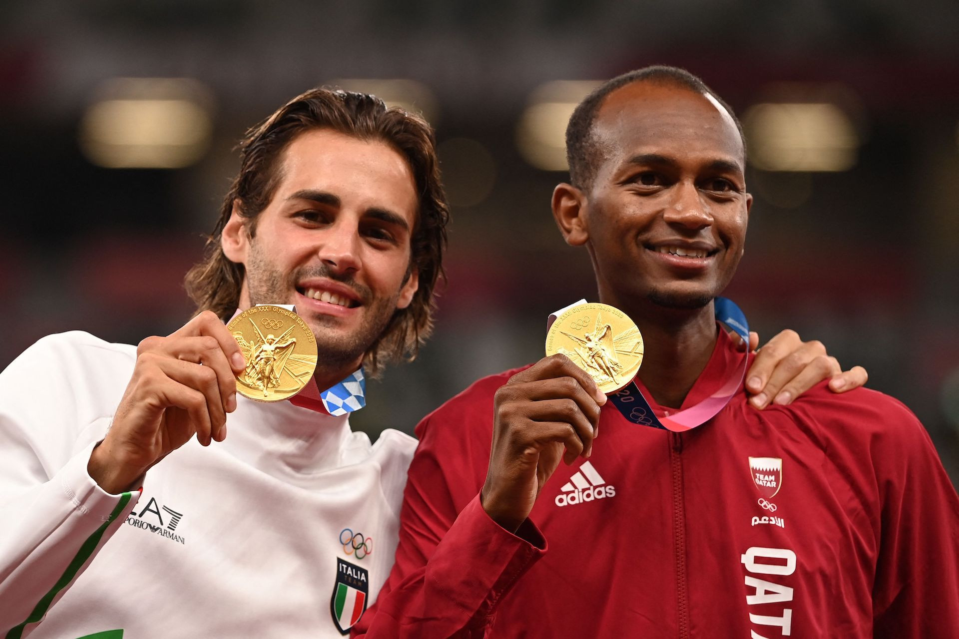 Qatar's Barshim (R) and Italy's Tamberi shared gold in the high jump at Tokyo 2020. GETTY IMAGES