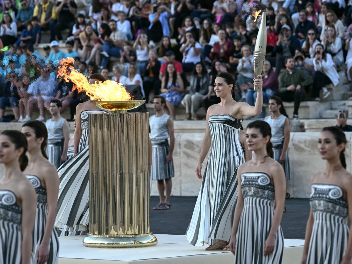 Greek actor Mary Mina holds the Olympic torch at the Panathinean stadium in Athens. GETTY IMAGES