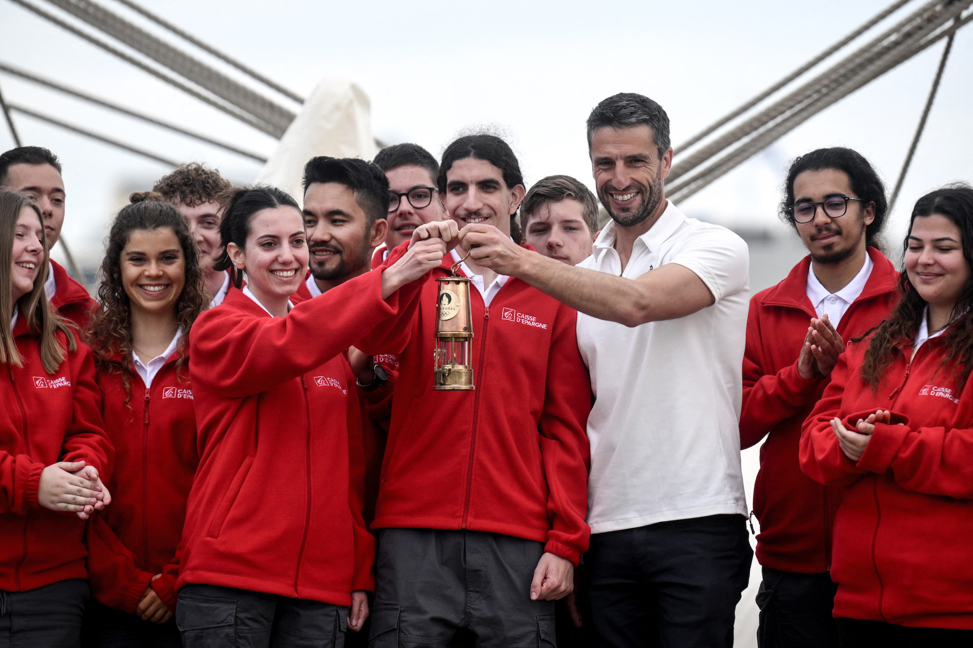 Tony Estanguet poses with sailors of the Belem in Athens. GETTY IMAGES
