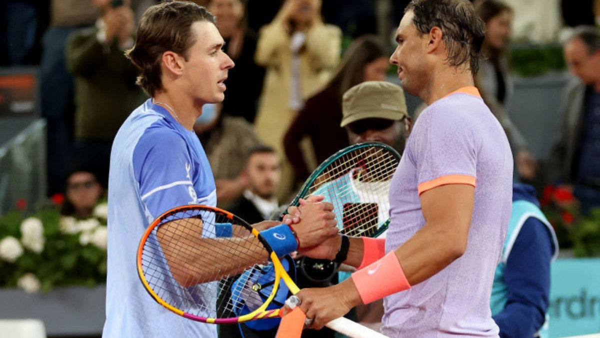 Nadal (R) and de Minaur shake hands after their match in Madrid. GETTY IMAGES