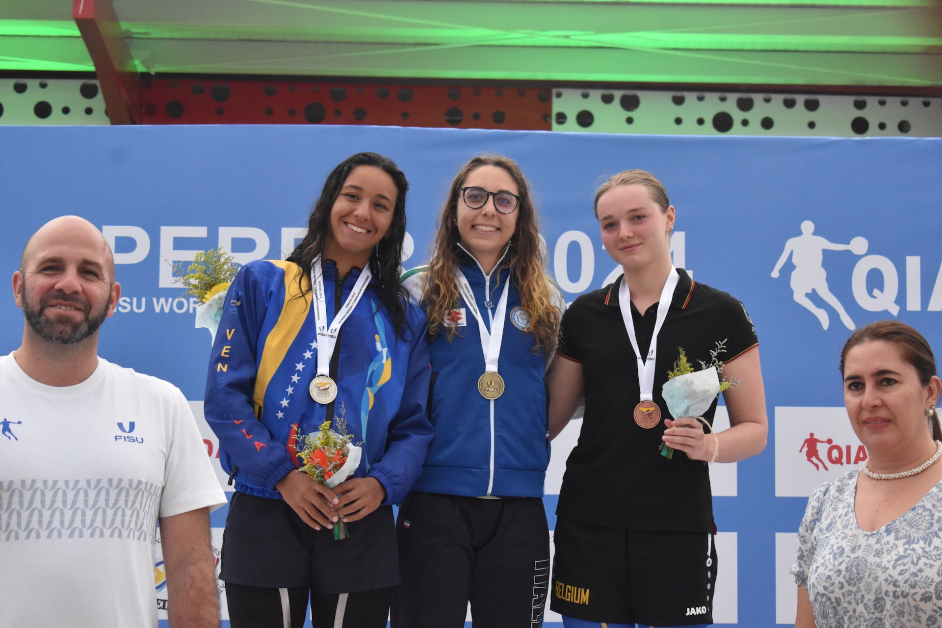 The student-athletes proudly show off their medals. FISU
