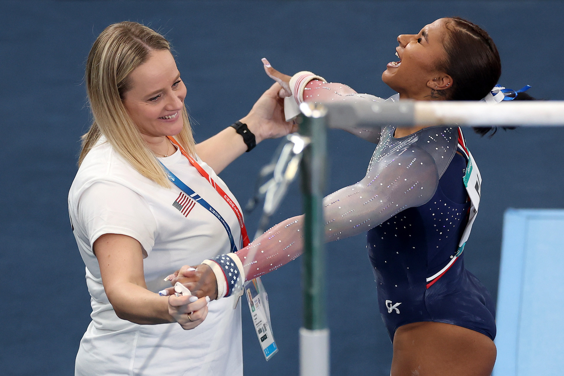 Canqueteau-Landi with elite gymnast Jordan Chiles during the uneven bar finals at the Pan Am Games 2023. GETTY IMAGES