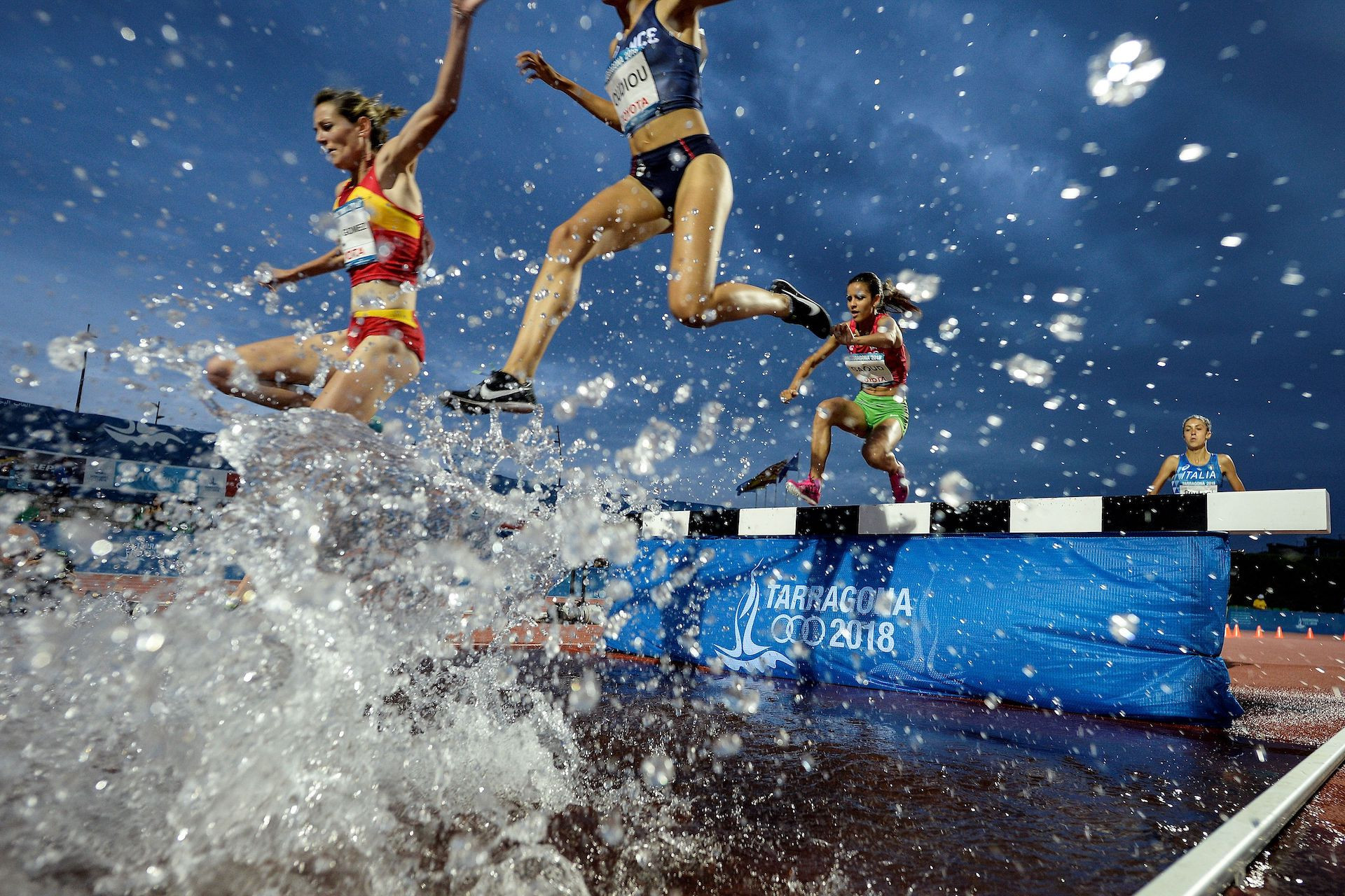 Athletes competing at the steeplechase track in the XVIII Mediterranean Games in Tarragona. GETTY IMAGES 