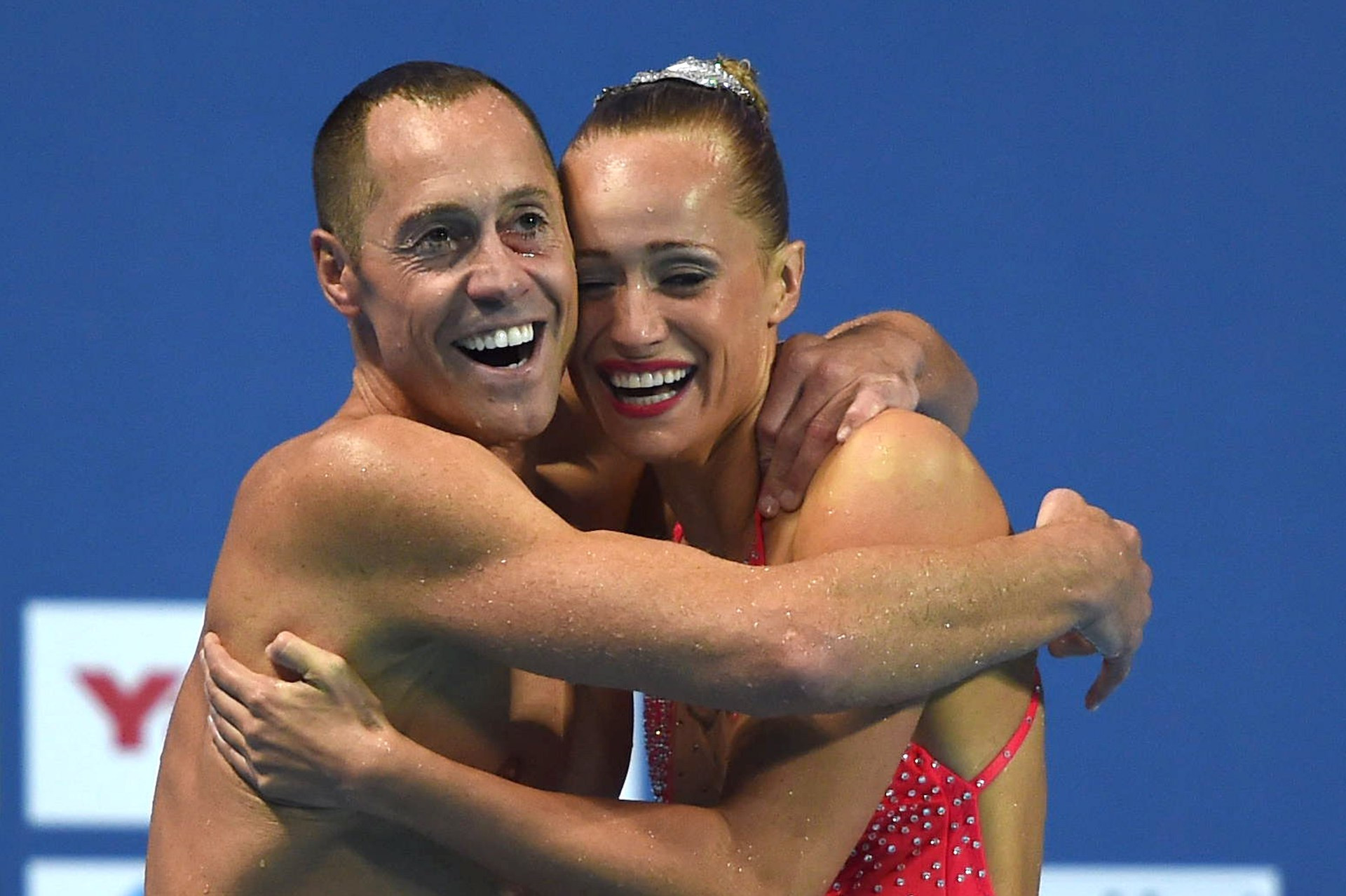 Bill May joyfully celebrates with his partner Christina Jones after competing in the Mixed Duet Technical in Kazan. GETTY IMAGES