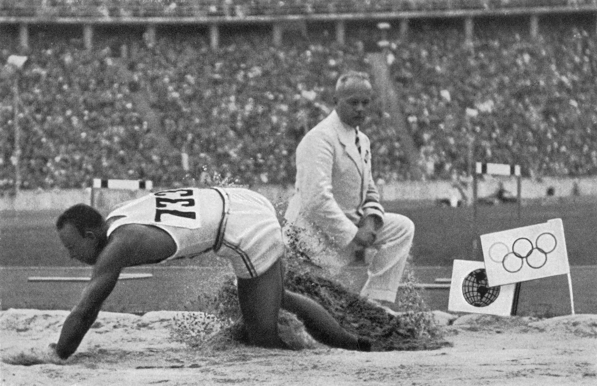 Owens competing at the long jump at the 1936 Berlin Olympics. GETTY IMAGES