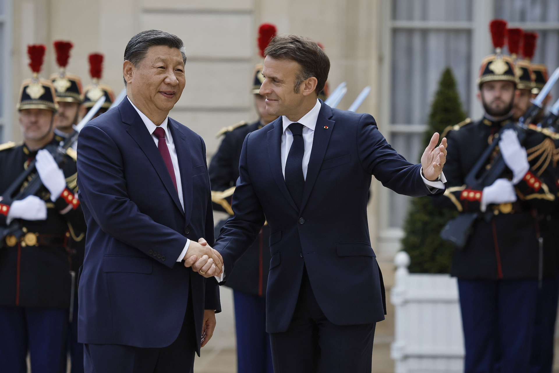 President of France Emmanuel Macron welcomes President of the People's Republic of China Xi Jinping. GETTY IMAGES