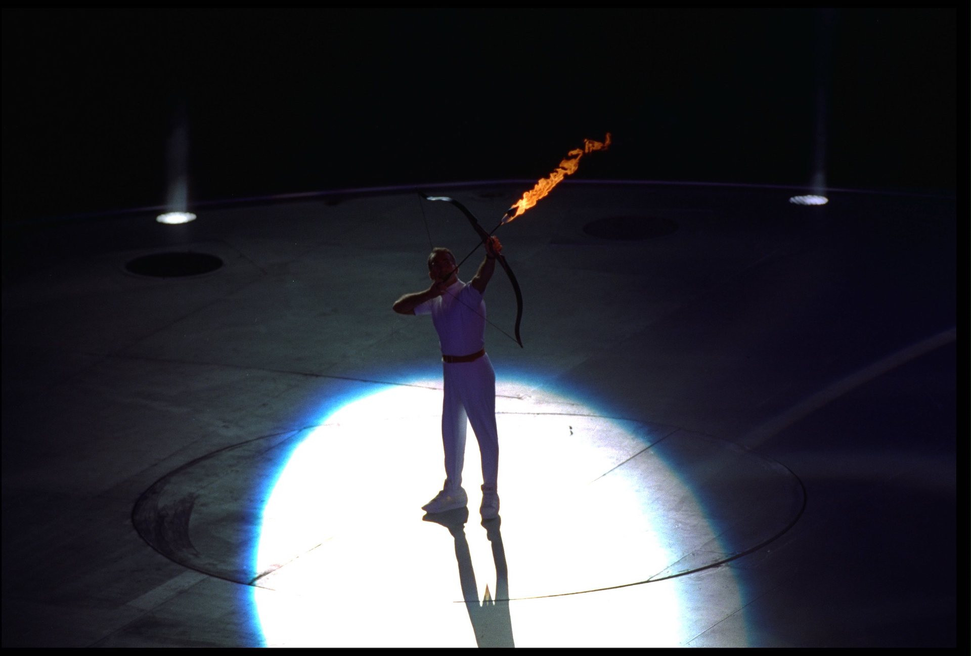 Paralympic archer Antonio Rebollo shooting lit arrow and lighting flame at Olympic Stadium, Barcelona, Spain. GETTY IMAGES