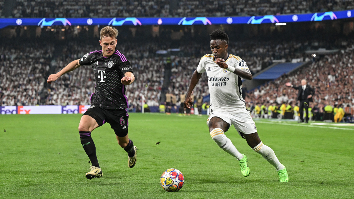 Vinicius Jr. competes for the ball with Joshua Kimmich during the UEFA Champions League semi-final at Estadio Santiago Bernabeu on 08 May 2024. GETTY IMAGES