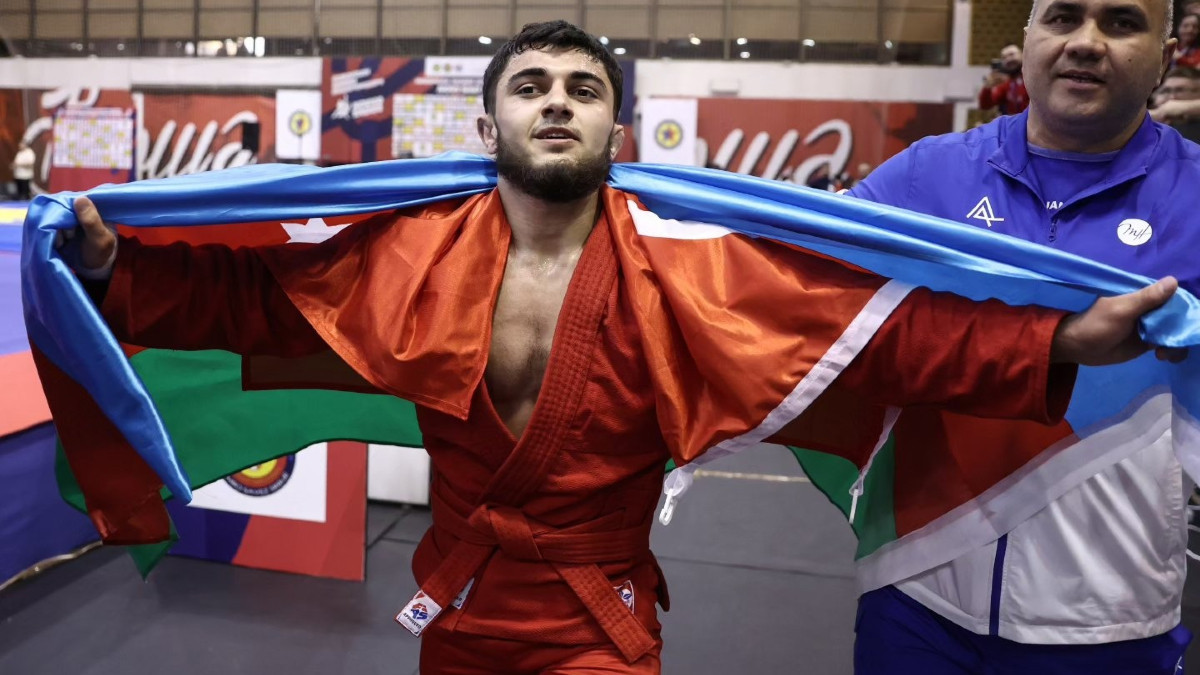 Elvin Baghirov of Azerbaijan celebrating his victory in the men's sport SAMBO 64 kg category. FIAS
