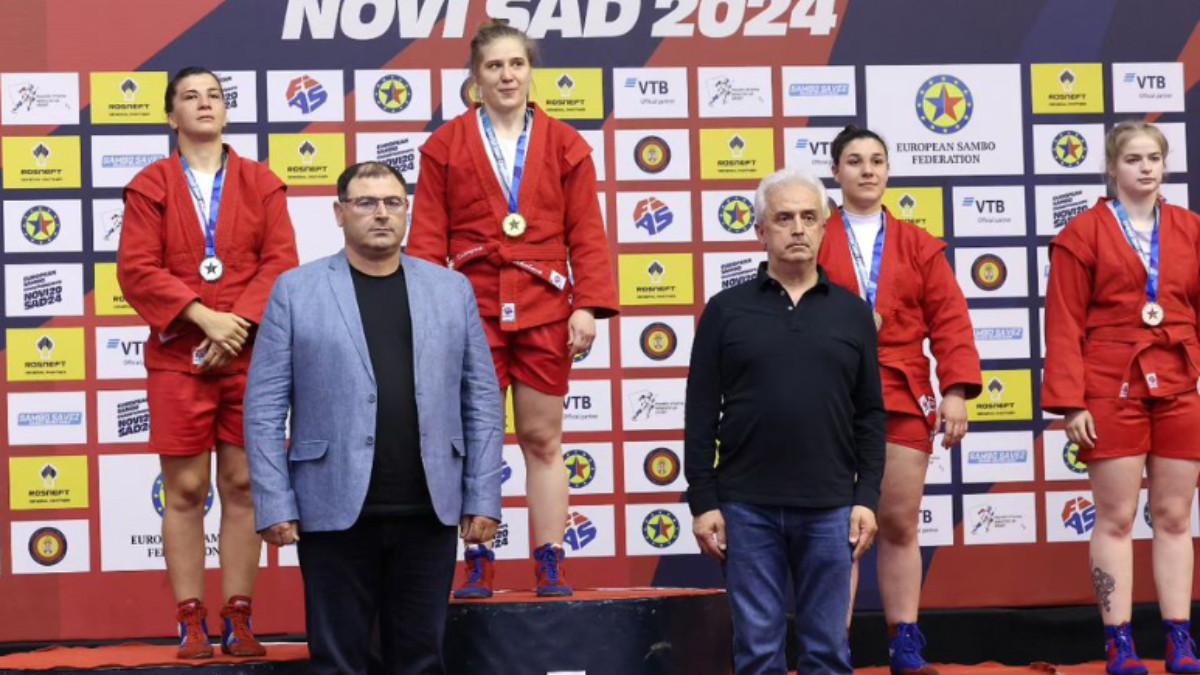 World Champion Katerina Moskalova from Romania at the top of the podium in the women's sport SAMBO 80 kg category. FIAS