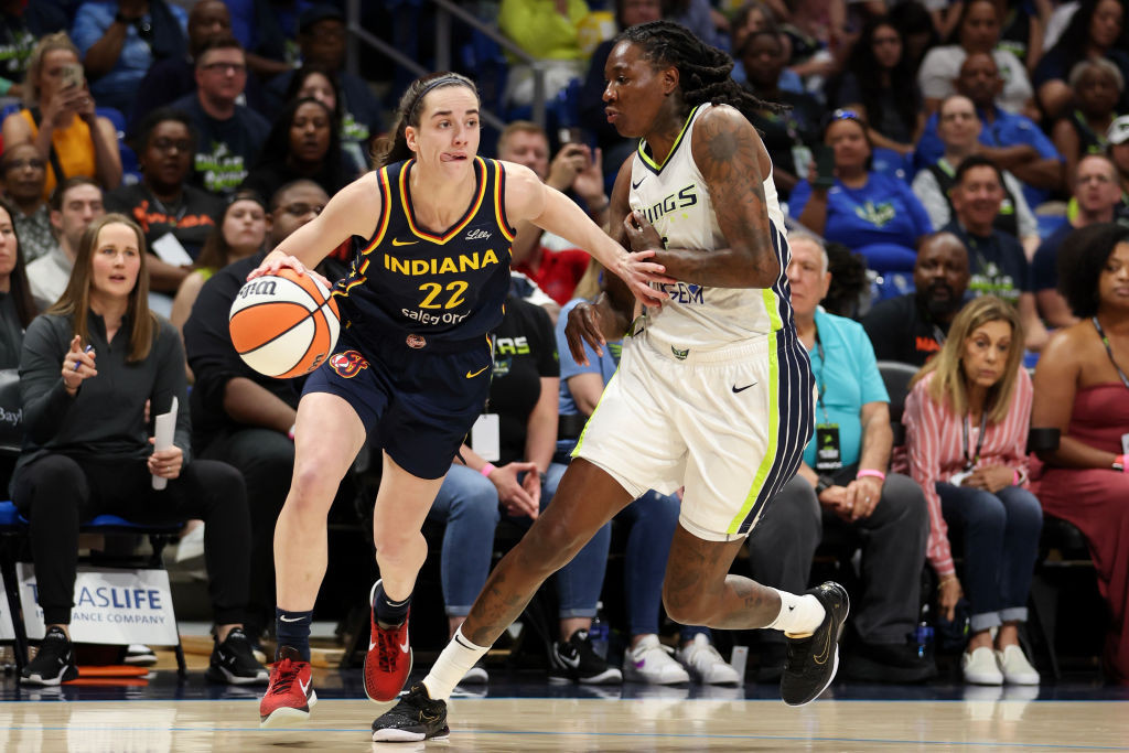 Caitlin Clark drives to the basket against the Dallas Wings during the first quarter in a preseason game. GETTY IMAGES