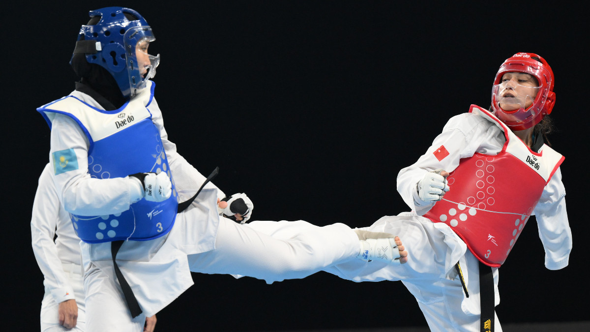 Surenjav Ulambayar from Mongolia (blue) defeated Meryem Betul Cavdar from Turkiye (red) in the final of the women's 52 kg category. GETTY IMAGES
