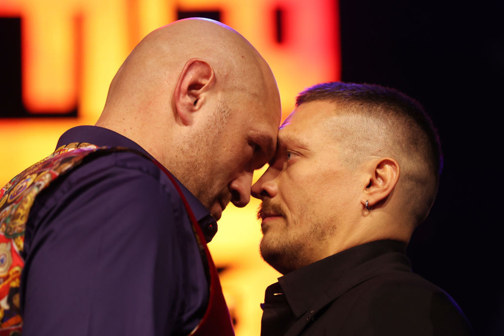 Tyson Fury and Oleksandr Usyk face off at a press conference. GETTY IMAGES