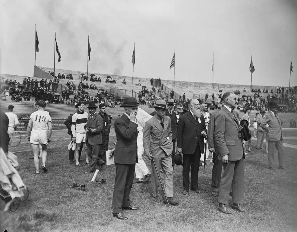 Pierre de Coubertin on the infield with athletes and officials during the 1924 Games joined by Edward, Prince of Wales, and former athlete Justinien de Clary. GETTY IMAGES