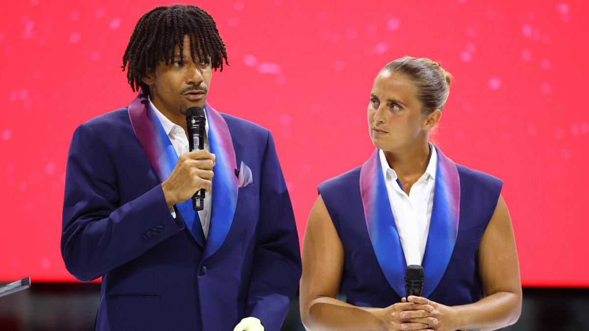Arnaud Assoumani and Pauline Déroulède at April's French team outfit launch. GETTY IMAGES