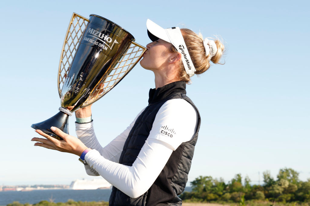 Nelly Korda poses with the winner’s trophy after winning the Mizuho Americas Open. GETTY IMAGES