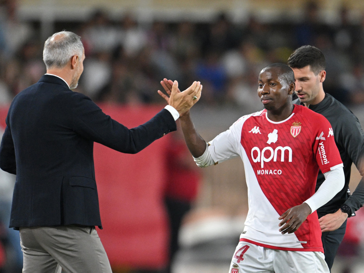 Mohamed Camara high-fives coach Adi Hutter during Monaco's match against Nantes. GETTY IMAGES