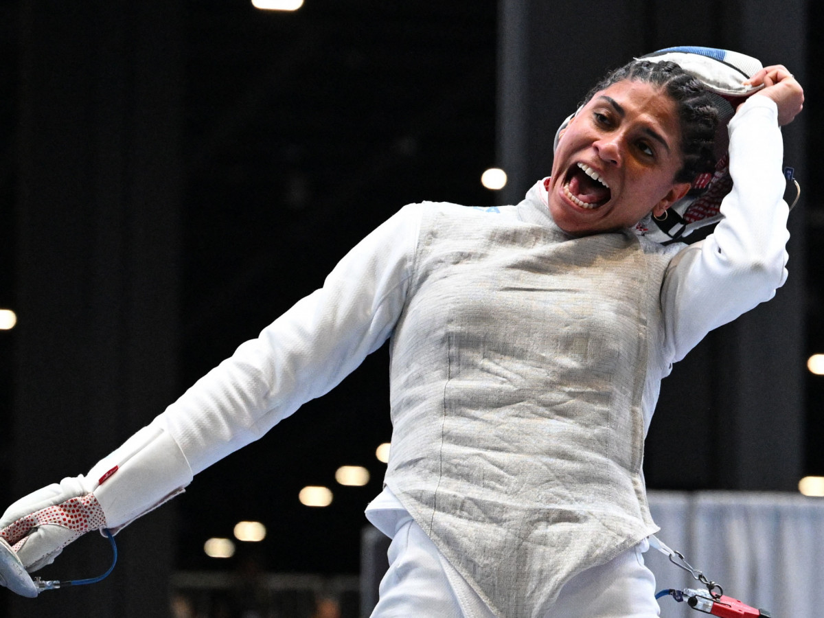 French fencer Ysaora Thibus celebrates a win in Milan. GETTY IMAGES