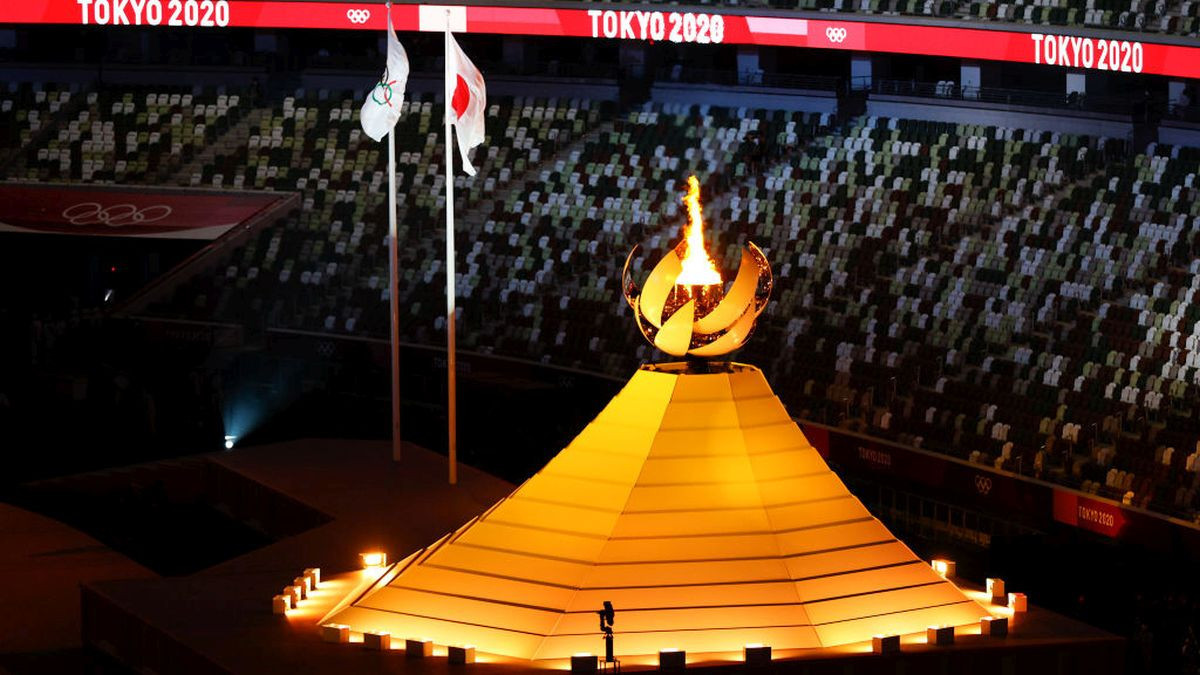 Empty seats are seen as the Olympic Flame burns after the lighting of the Olympic Cauldron during the opening ceremony of the Tokyo 2020. GETTY IMAGES