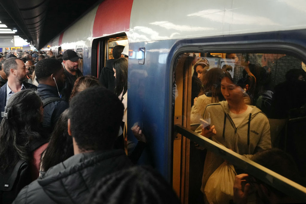 Commuters try to get inside a train during a strike called by SNCF employees. GETTY IMAGES
