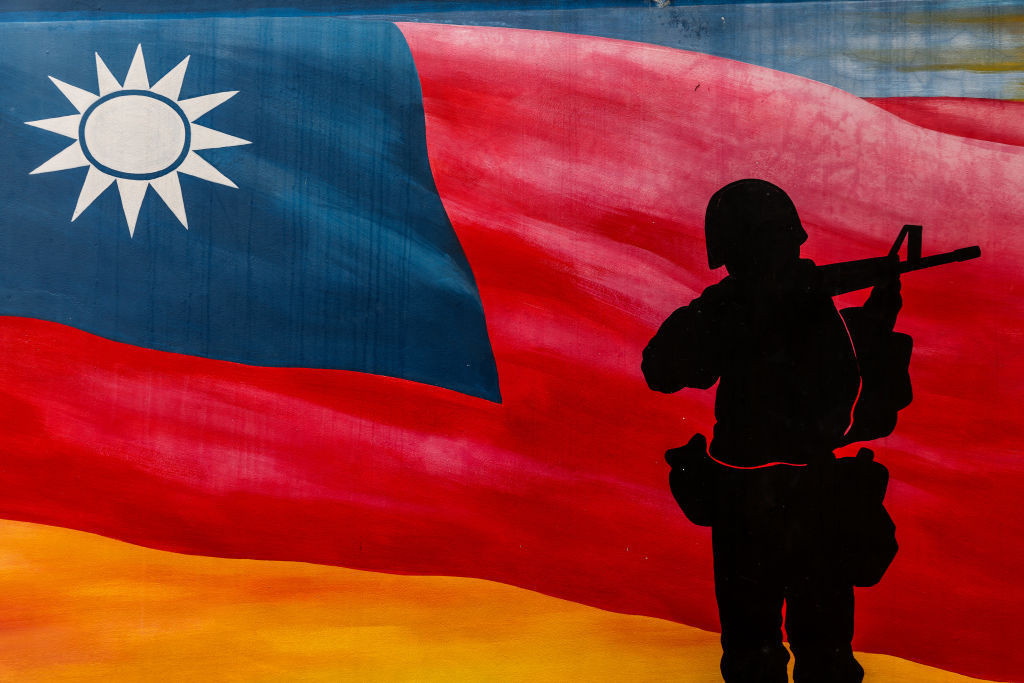 A painting of Taiwan's national flag and a soldier is seen at Yangzhai Old Street in Kinmen. GETTY IMAGES