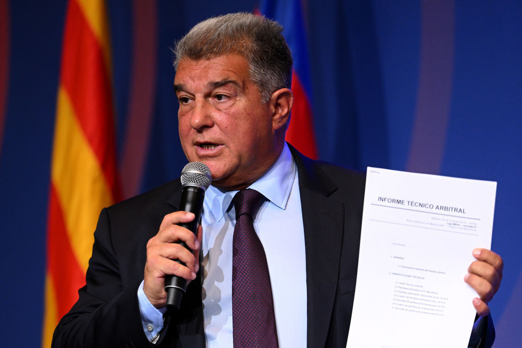 FC Barcelona President Joan Laporta gives a press conference while showing a referee technical report. GETTY IMAGES