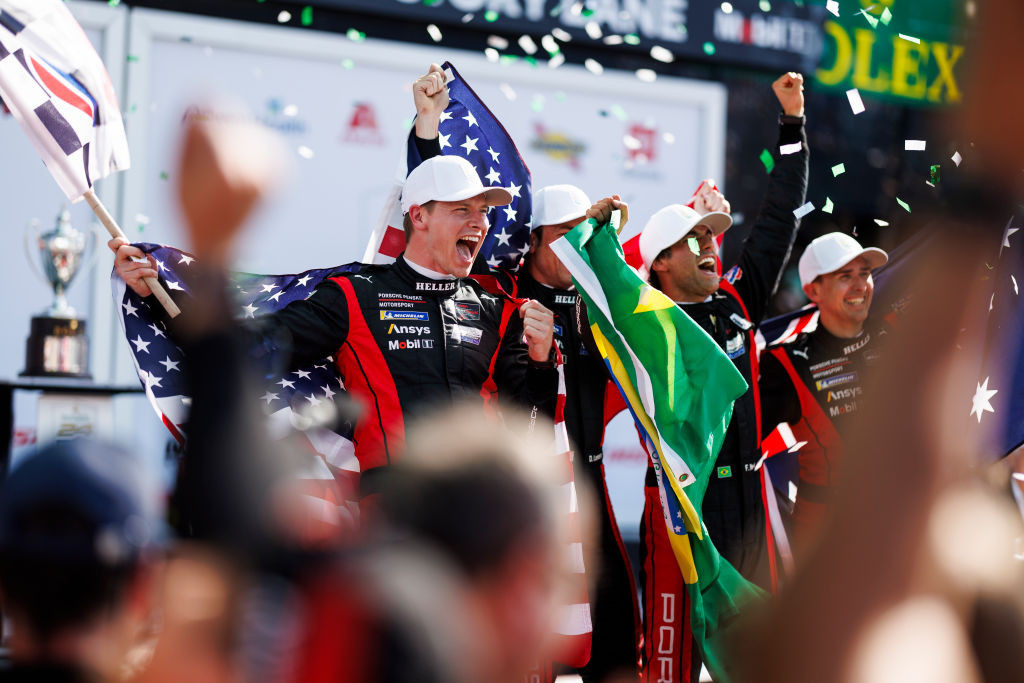 Josef Newgarden celebrates in victory lane with his team. GETTY IMAGES