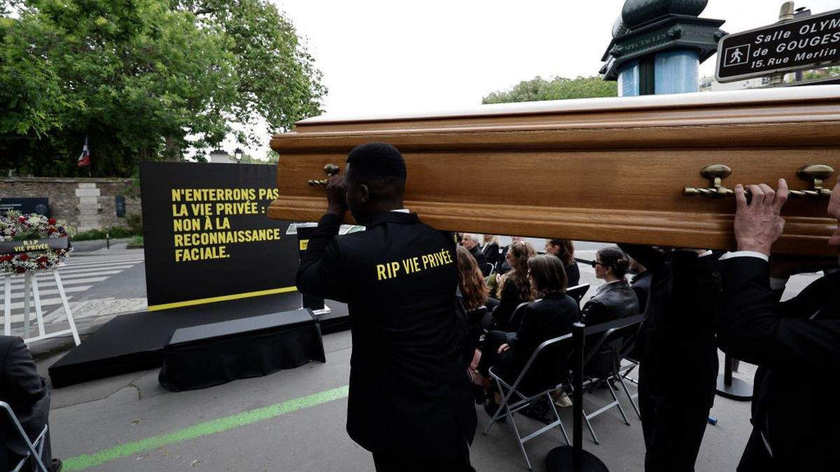 Members of Amnesty International France carry a coffin during a symbolic action against facial recognition on 28 may in Paris. GETTY IMAGES